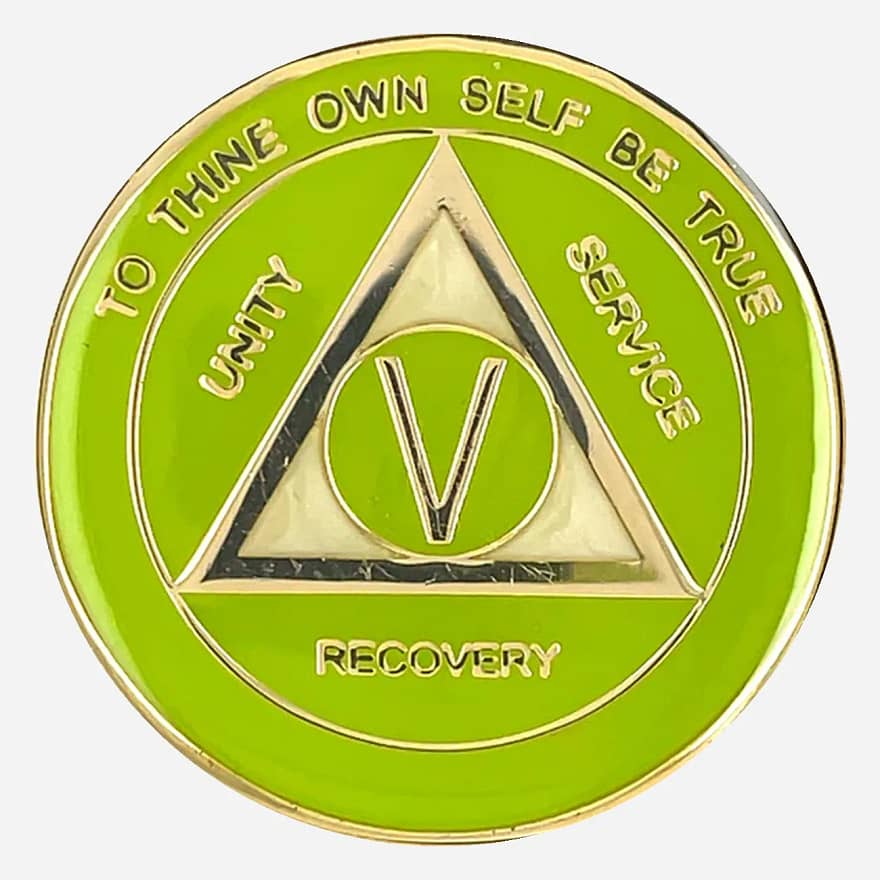 A vibrant AA sobriety medallion (34mm) featuring a lime green enamel border and a luminous pearlized center, all set on a gold-tone coin. The front displays the classic AA circle and triangle symbol, surrounded by 'Unity,' 'Service,' and 'Recovery.' The outer rim is inscribed with 'To Thine Own Self Be True' and the sobriety anniversary year (in Roman numerals, 1-40 years). This high-quality token has a smooth, glossy finish, highlighting its bright colors.