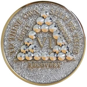 A gold and silver coin with pearls on it