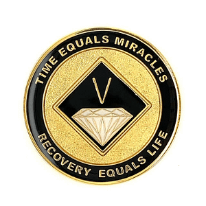 A gold and black coin with the words time equals miracles, recovery equals life.