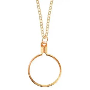 A gold necklace with a large circle pendant.
