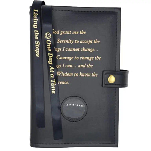 A black book with a strap and a button.
