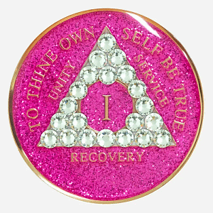 Reflect Grace and Strength with the Crystal AA Medallion Glitter Pink/Diamond The Crystal AA Medallion Glitter Pink/Diamond is a vibrant emblem of resilience and grace, crafted for those committed to the path of sobriety. With a sparkling pink background and diamond-clear Swarovski crystal accents, this medallion serves as a beautiful reminder of each accomplishment. Hand-painted by individuals in recovery, it honors the strength it takes to achieve every milestone, from 1 to 50 years. Features: Material: Made with genuine Swarovski crystals and a radiant pink glitter finish, this Glitter Pink Diamond Crystal AA Medallion symbolizes grace, perseverance, and hope. Each medallion is coated in a scratch-resistant resin dome, maintaining its brilliance through the journey of recovery. Front Design: The AA triangle is surrounded by diamond-clear crystals set against a glittering pink background. The phrase “To Thine Own Self Be True” shines in bold relief, representing the authenticity and courage in sobriety. Roman numerals within the triangle commemorate each year, adding a unique and personal tribute to each milestone. Back Design: A single diamond-clear Swarovski crystal graces the center of the engraved Serenity Prayer on the reverse, providing daily encouragement and serenity. Dimensions: This Crystal AA Chip Glitter Pink/Diamond measures 34mm (1.34 inches) in diameter, designed to be both beautiful and portable, allowing it to serve as a steady reminder of each victory in recovery. Durability: The high-quality resin dome protects the sparkling pink finish and crystal accents from scratches and chips, ensuring this medallion remains as strong and radiant as the individual it represents. Benefits: Symbolism: The glittering pink background paired with diamond-clear crystals symbolizes grace, resilience, and inner strength. This medallion represents the balance between softness and courage, qualities that shine throughout the journey of sobriety. Personalization: Roman numerals marking 1 to 50 years allow for a deeply personal connection to each year in recovery, creating a unique reminder of each milestone achieved and challenge overcome. Gifting: Arriving in an elegant velour pouch, this medallion makes a thoughtful and supportive gift for anyone marking their path in sobriety. Its design offers encouragement and symbolizes the strength and beauty found in each step forward. Order Your Crystal AA Medallion Glitter Pink/Diamond Today Celebrate each milestone with the Crystal AA Medallion Glitter Pink/Diamond. Place your order today to receive fast, free shipping, ensuring that your medallion arrives in time to honor your achievements or support someone on their journey in sobriety. Complete the Gift with: Key Chain Holders Make your medallion a daily companion with one of our durable Key Chain Holders, designed to protect and display your token with elegance and ease. Sober Greeting Cards Pair your medallion with a heartfelt message by selecting from our Sober Greeting Cards, perfect for sharing words of encouragement and marking each milestone. Book Covers with Chip Holders Display your medallion alongside your recovery literature with one of our stylish Book Covers with Chip Holders, crafted to protect both your medallion and books as you journey forward.