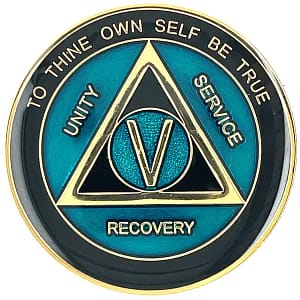 A blue and black coin with the words recovery written on it.