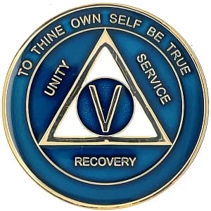 A blue and gold medal with the words recovery written on it.