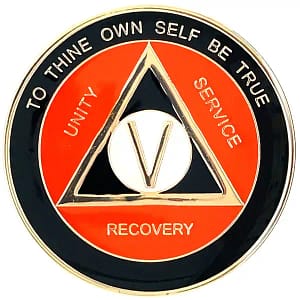 A red and black coin with the words " unity, service, recovery ", and " to thine own self be true ".