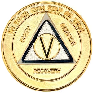 A gold colored coin with the words " to thine own self be true " written on it.