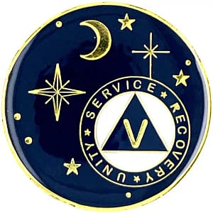 A blue and gold pin with the letters v in front of a moon, stars, and crescent.
