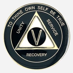 A black and pearl AA triplate token with gold accents, with the words "To Thine Own Self Be True" and "Unity Service Recovery" on the front of coin.