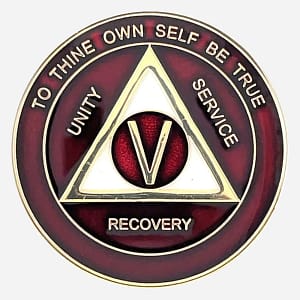 Alcoholics Anonymous medallion (34mm) with a rich burgundy enamel border and a shimmering pearlized center. Features a gold-plated AA circle and triangle symbol, encircled by 'Unity,' 'Service,' 'Recovery' in gold lettering. The outer edge reads 'To Thine Own Self Be True' and the sobriety year (1-50), all in gold. The coin has a glossy, epoxy-coated finish that enhances its deep colors and provides durability.