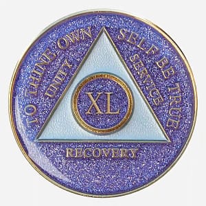 A vibrant display of the Triplate AA Token Glitter Purple, highlighting the intricate details of the AA symbol and empowering motto against a mesmerizing purple glitter backdrop.