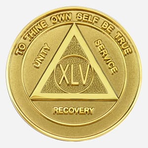 A gleaming, entirely gold-plated Alcoholics Anonymous medallion (34mm) showcasing a unified design. The center prominently features a gold AA circle and triangle symbol, surrounded by 'Unity,' 'Service,' and 'Recovery' in matching gold lettering. The outer rim displays 'To Thine Own Self Be True' at the top and the specific sobriety year (1-50) at the bottom, all in gold. This coin boasts a glossy, protective epoxy coating, enhancing its radiant finish and durability.