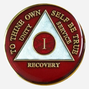 Representing courage and passion for recovery, this Triplate AA Token showcases a bold red AA symbol and motto against a clean white background.