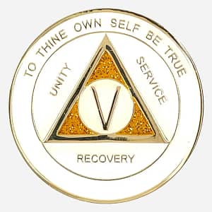 The front of AA triplate token in white and gold with gold glitter accents, having the words "To Thine Own Self Be True" and "Unity Service and Recovery" written on it.