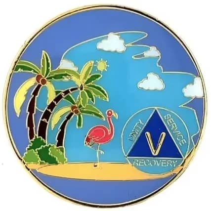 A blue circle with palm trees and flamingos on it.