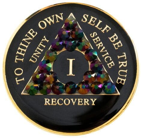 A black and gold medallion with the words recovery