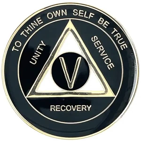 A black and gold medal with the words recovery written on it.