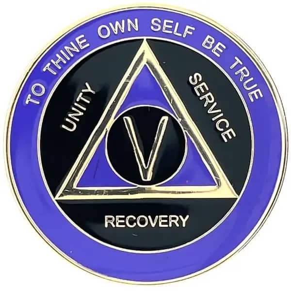 A blue and black medal with the words recovery, unity, service, and unity.