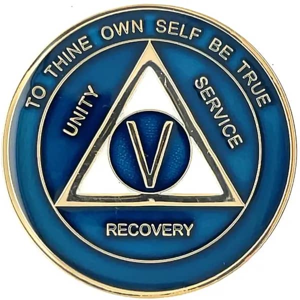 A blue and gold medal with the words recovery written on it.