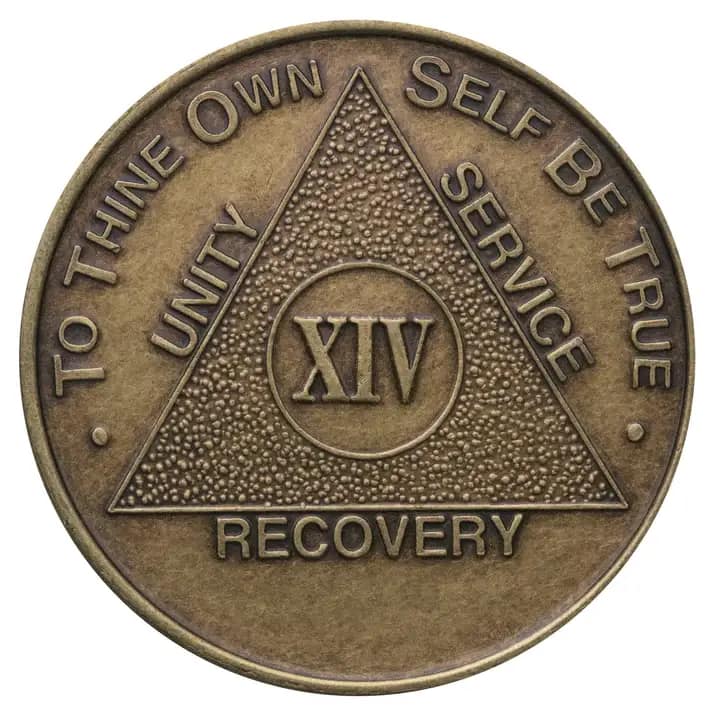 A bronze medal with the words recovery written on it.