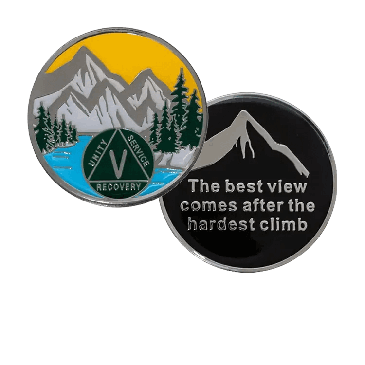 Front view of a Designer AA Coin with a Mountain scene, celebrating 1-60 years of sobriety.