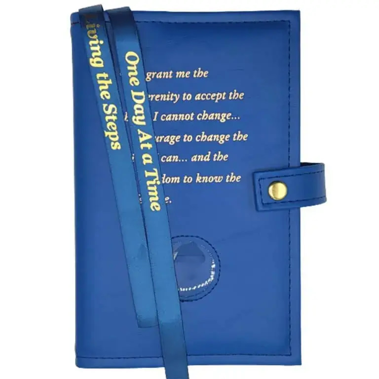 A blue book with a lanyard and a quote.