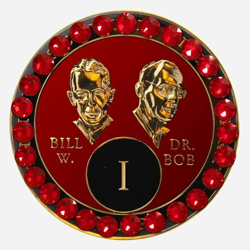 Red AA medallion with red accents, featuring stylized busts of Bill W. and Dr. Bob, commemorating sobriety.