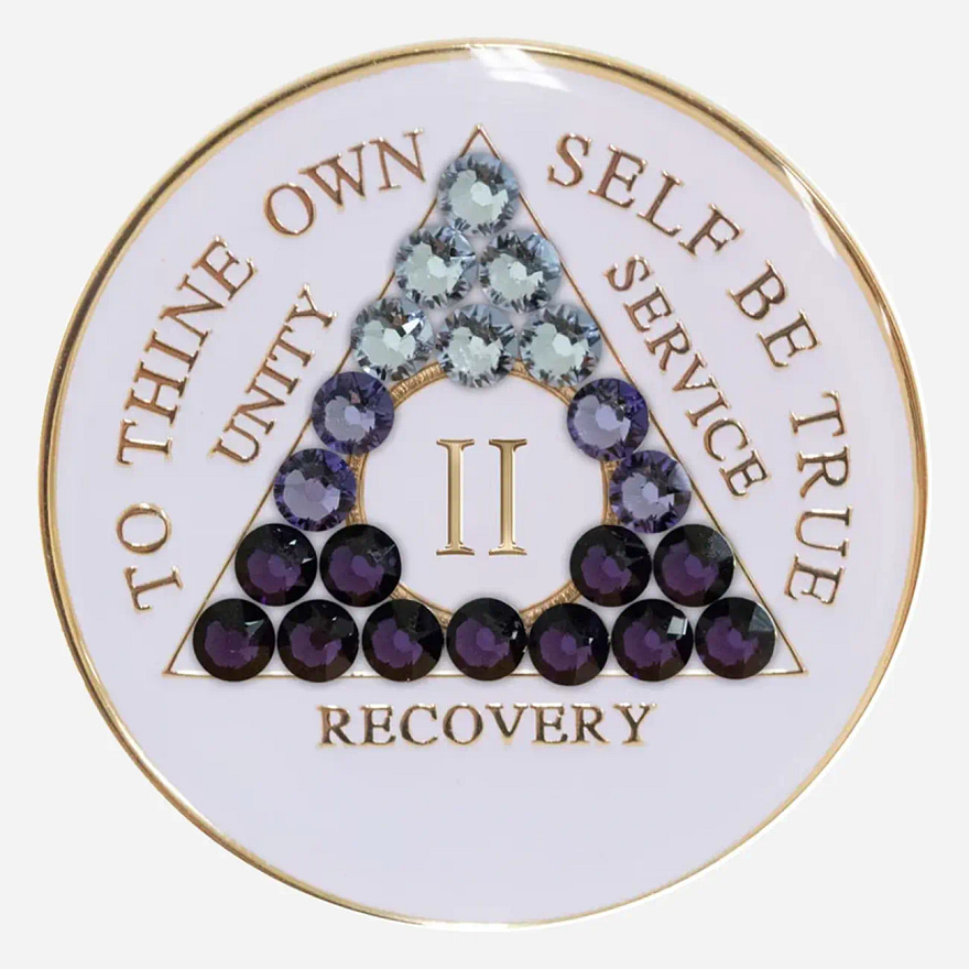 A white crystal AA medallion with a purple transition, featuring the AA symbol and sobriety year options.