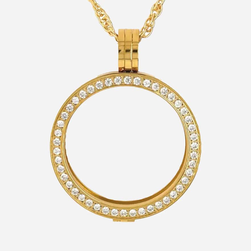 Golden rays of light dance off the crystal bezel of this AA medallion holder necklace, capturing the essence of hope and resilience