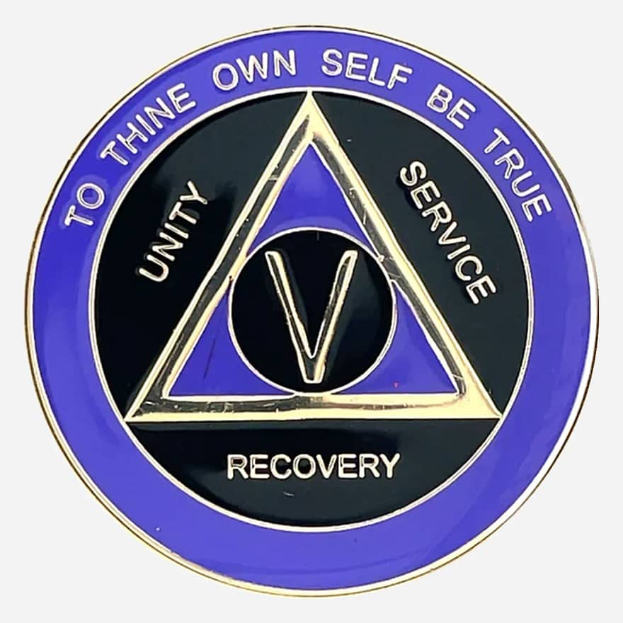 Alcoholics Anonymous sobriety medallion (34mm) featuring a deep black enamel base accented with a rich purple outer ring. A gold-plated AA circle and triangle symbol is centered, framed by 'Unity,' 'Service,' 'Recovery' in matching gold script. The outer rim displays 'To Thine Own Self Be True' at the top and the specific sobriety milestone (1-50 years) at the bottom, all in gold. This coin boasts a protective, glossy epoxy finish, highlighting its elegant design.