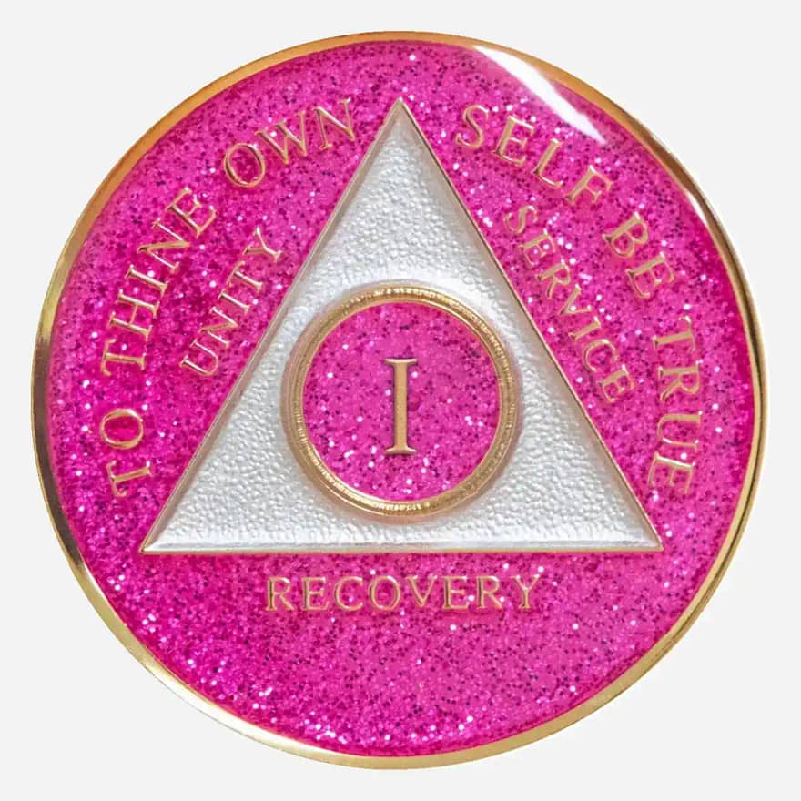 The Triplate AA Token Glitter Pink sparkles with inspiration. The classic AA symbol and "To Thine Own Self Be True" motto are prominently displayed on a beautiful pink glitter background.