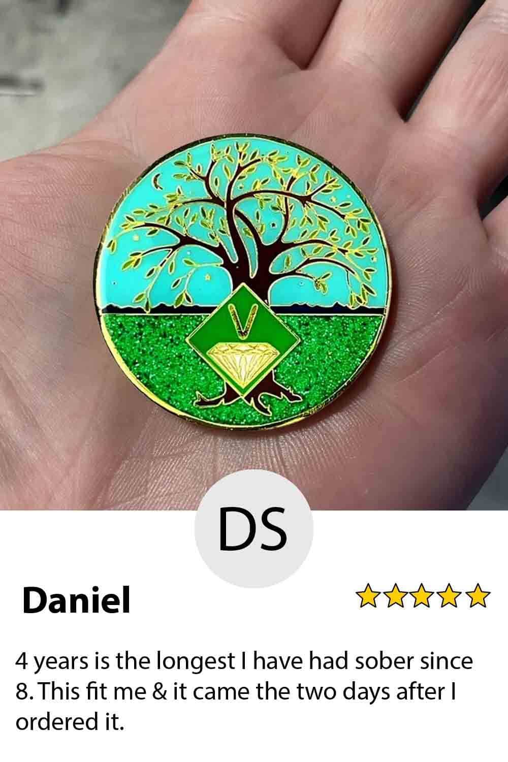A person holding a coin with the name daniel on it.