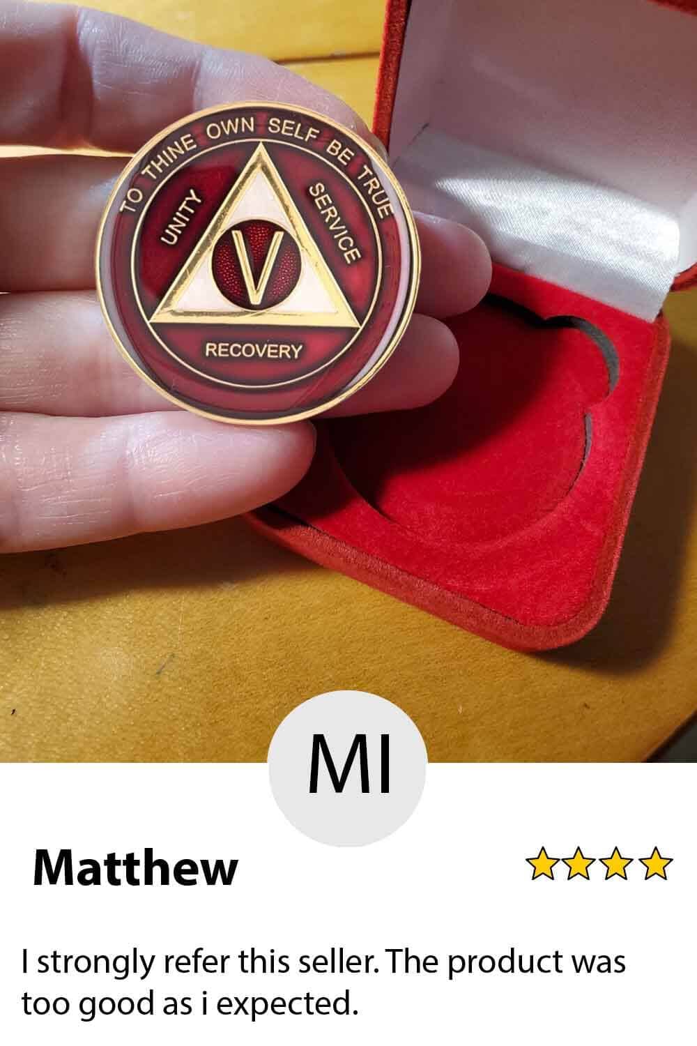 A person holding up a coin with the name of mi